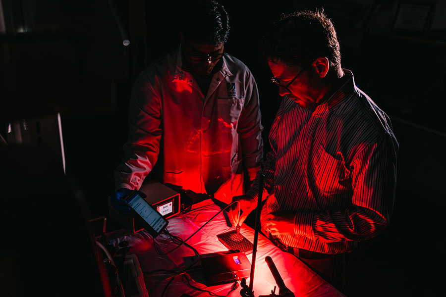 Jonathan Celli and Shakir Khan in the lab