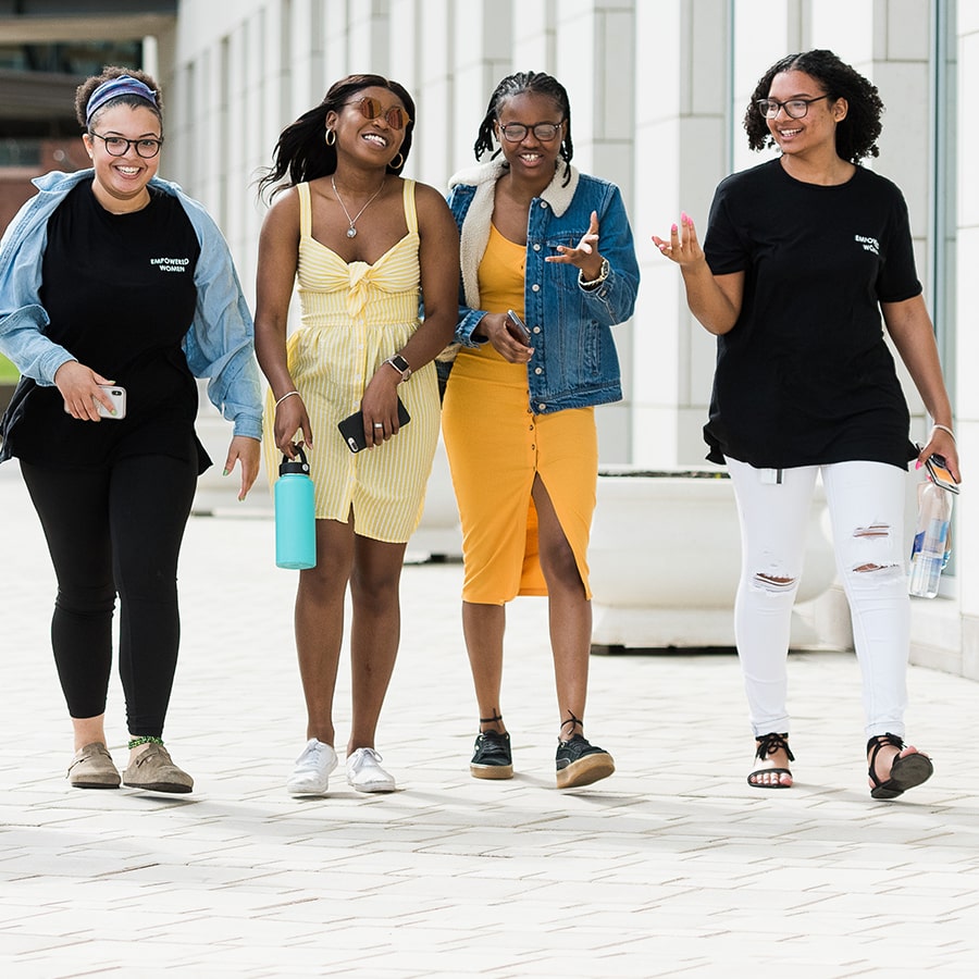 4 Girls walk on plaza