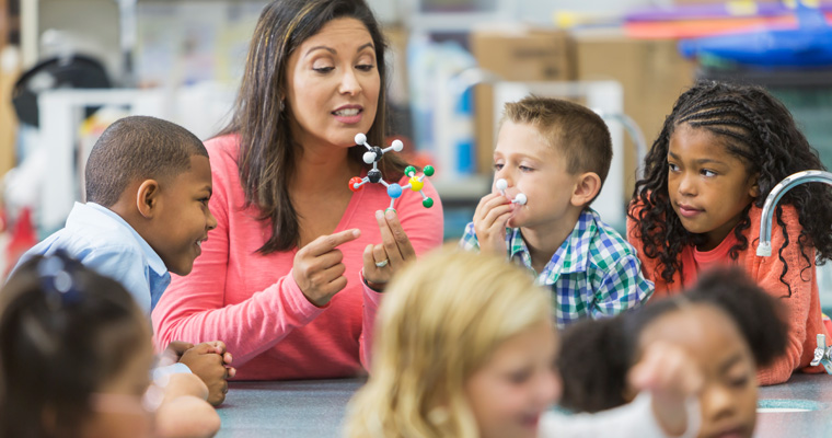 Science teacher with students 