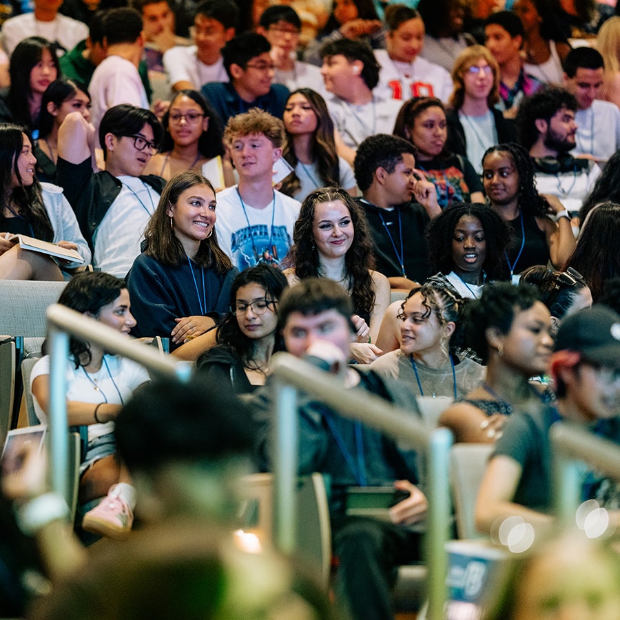 Crowd of students front view seating at Orientation.