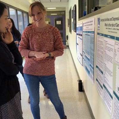 Gerontology Researchers at a poster board session.