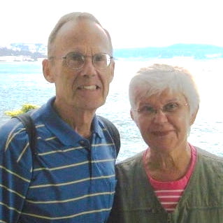 Older couple in front of water