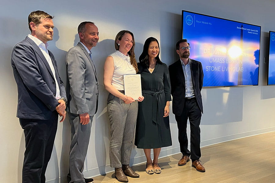 Katherine Dafforn receives her Climate Leadership Award from Mayor Wu