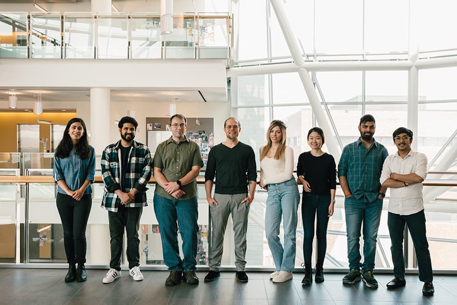 UMass Boston researchers pose for a photo.